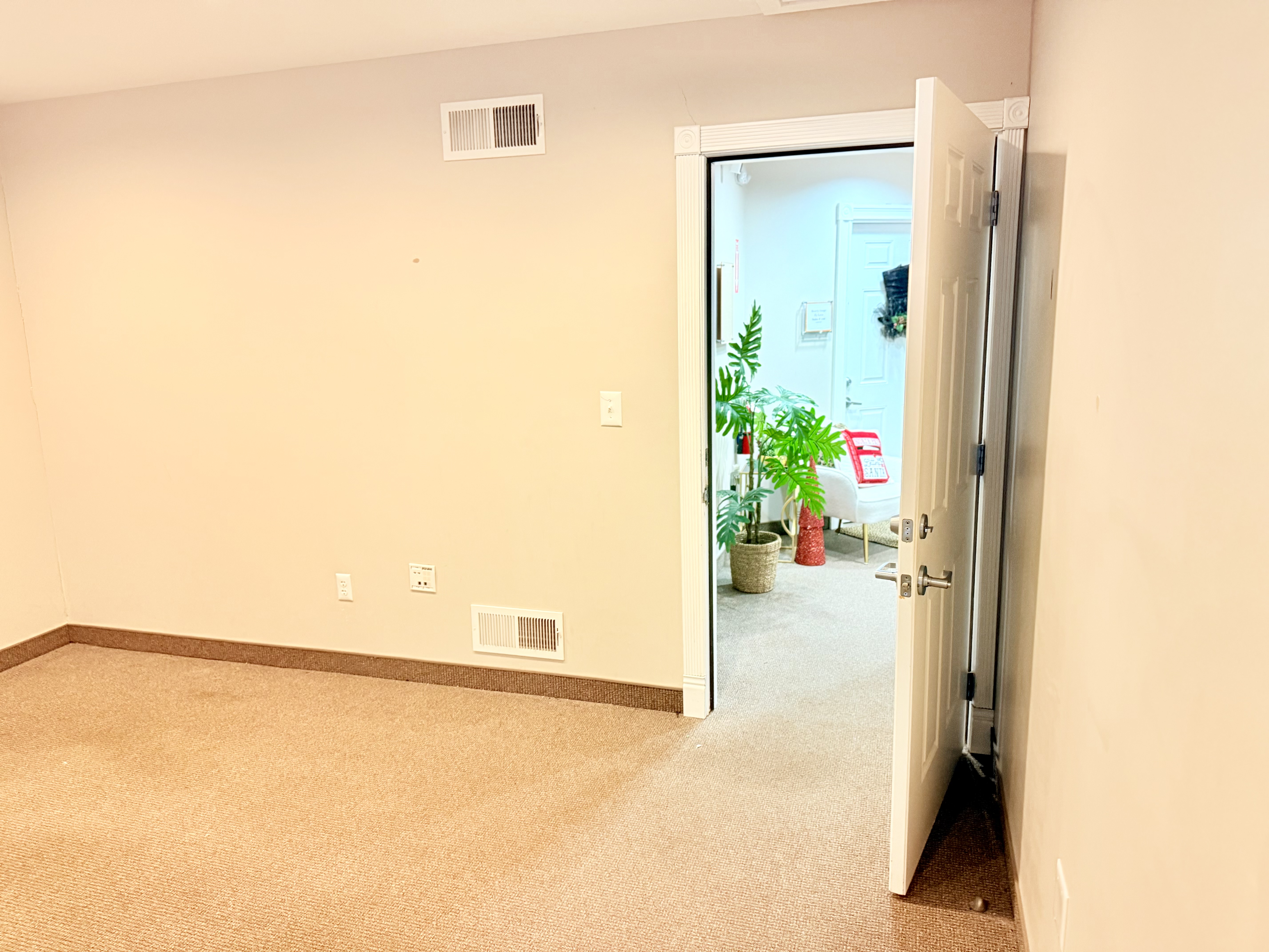 Suite 105 — corner view with windows