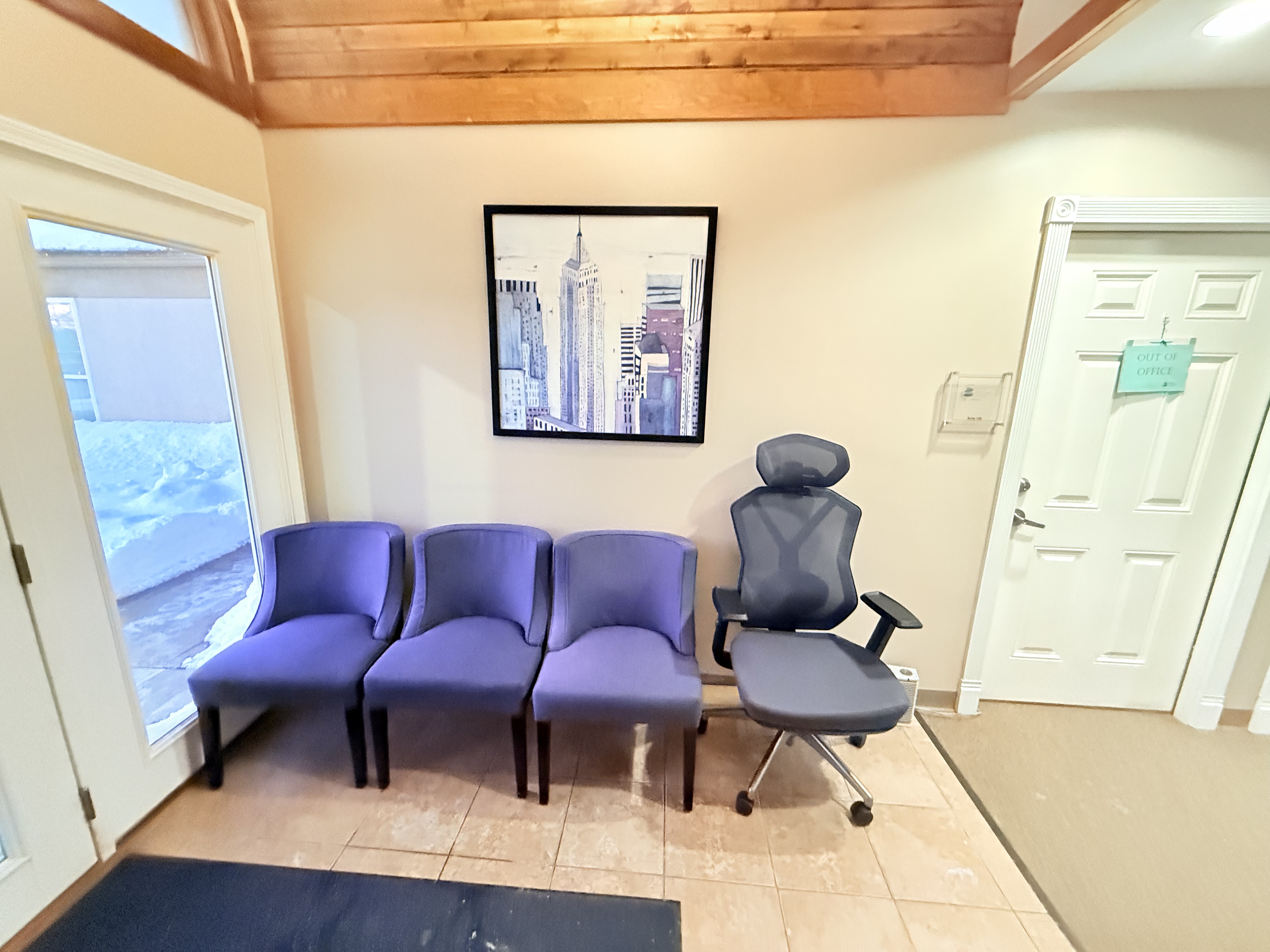 Reception and waiting area with seating at Barrett Properties office building